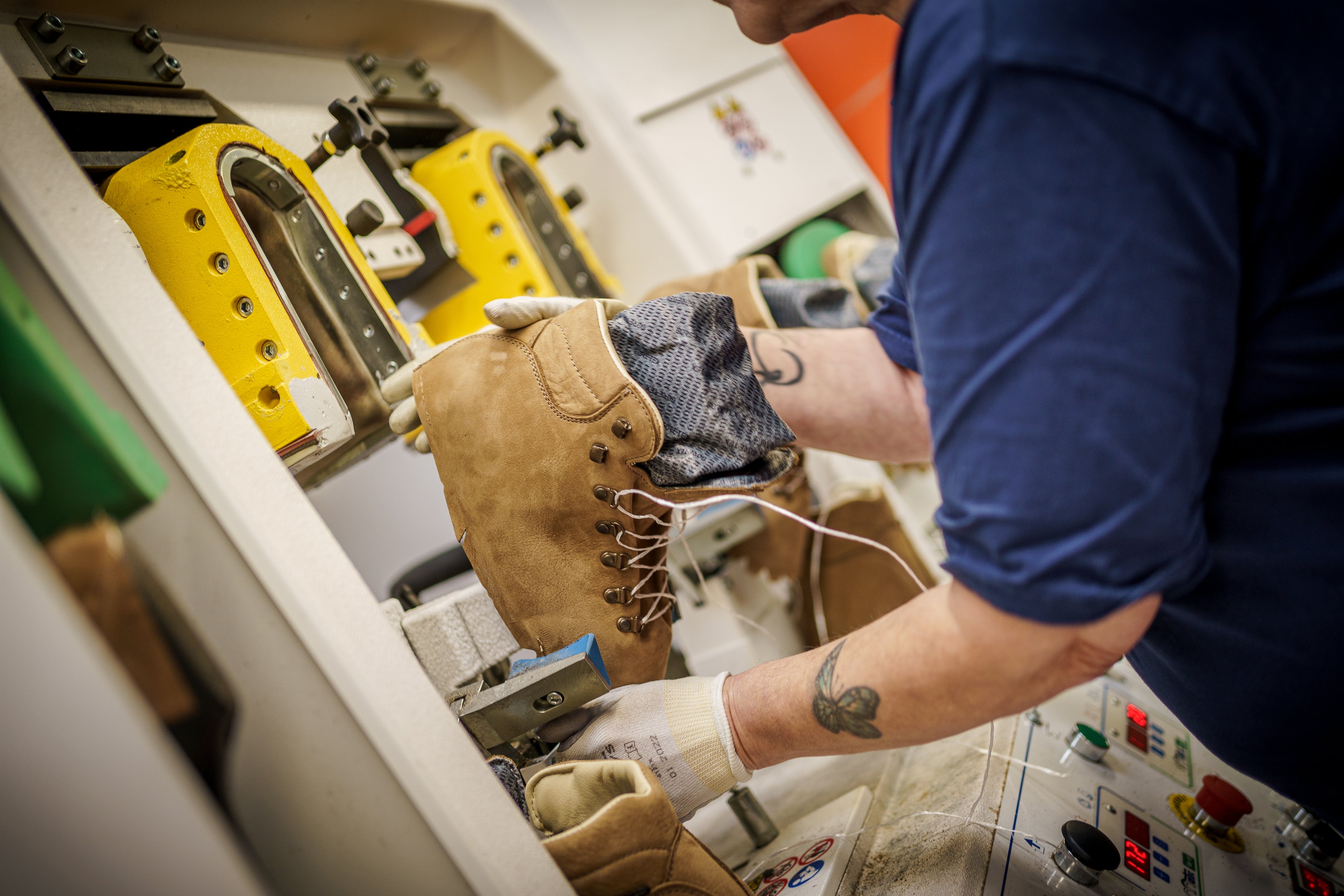 Zamberlan factory employee assembling hiking boots. 